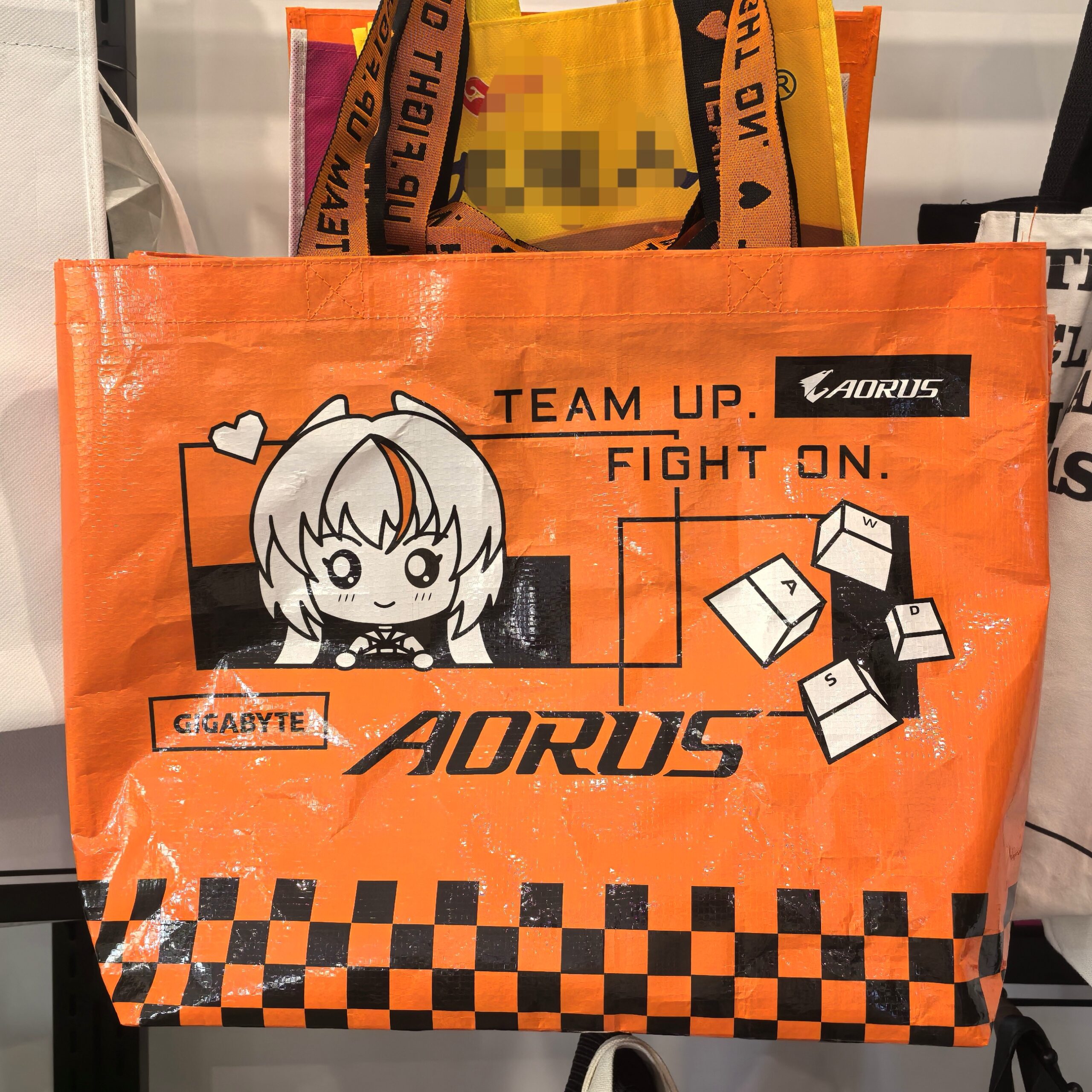 Orange AORUS gaming-themed PP woven tote bag