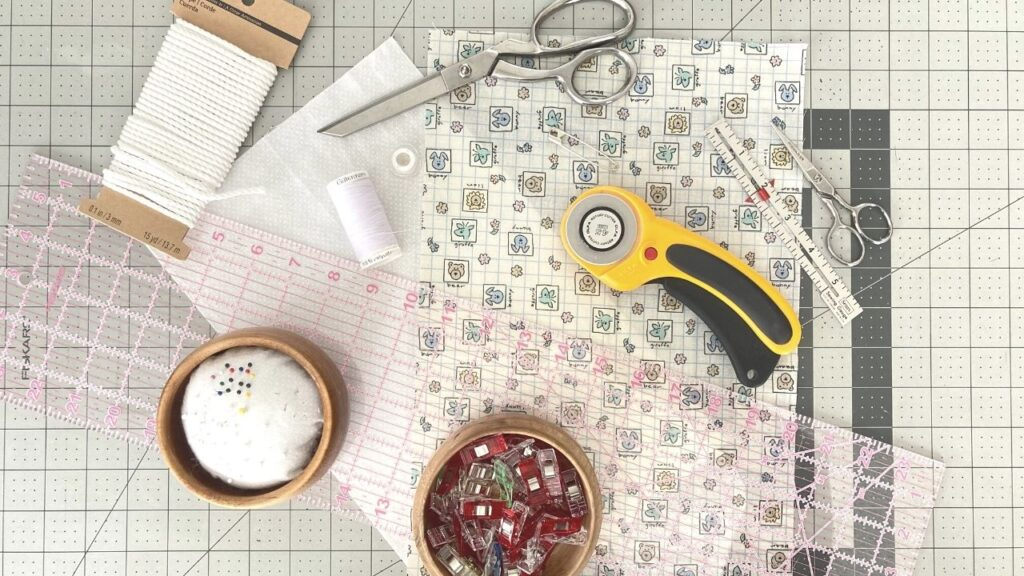 Sewing tools and materials arranged on a crafting table