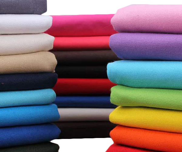 Stacks of colorful non-woven fabric materials for making reusable bags