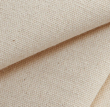 Close-up of beige non-woven fabric texture, showing detailed weave pattern