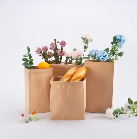 Brown paper bags with bread and flowers, eco-friendly and reusable