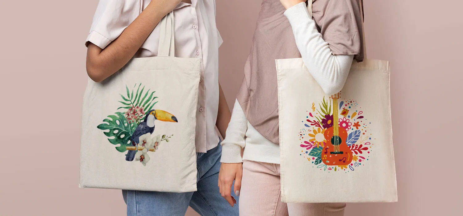 Two people holding eco-friendly canvas tote bags with colorful printed designs