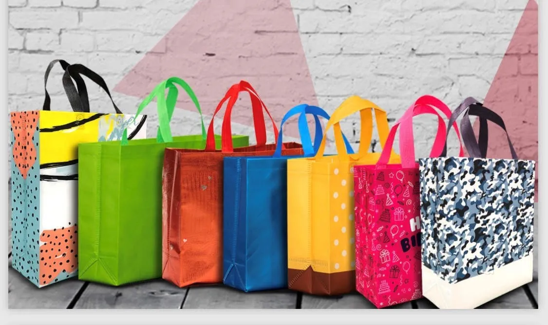 Colorful non-woven bags with vibrant patterns and sturdy handles