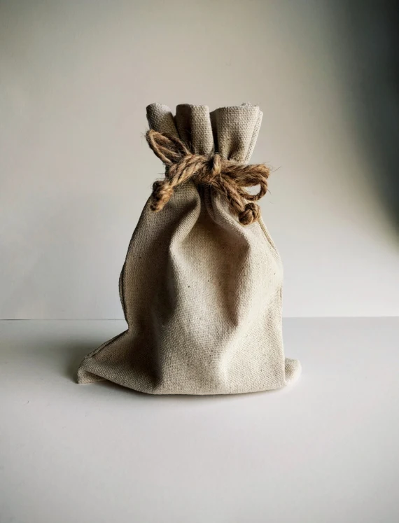 Eco-friendly beige drawstring bag made of natural fabric