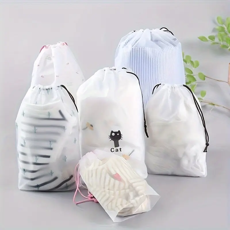 Transparent plastic drawstring bags in various sizes, ideal for storage and travel