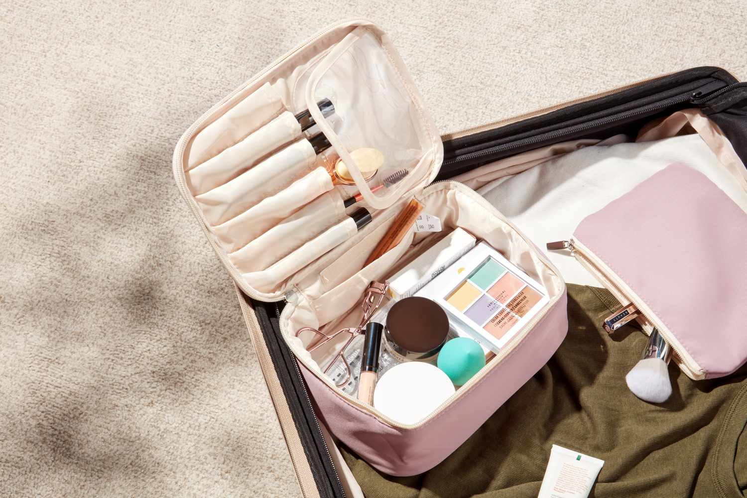 Spacious travel makeup bag with compartments for brushes and cosmetics