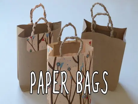 Decorative paper bags with rope handles and floral patterns