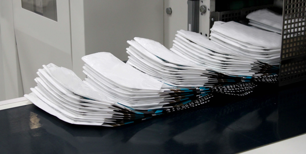stacked non-woven bags, showcasing finished products in production