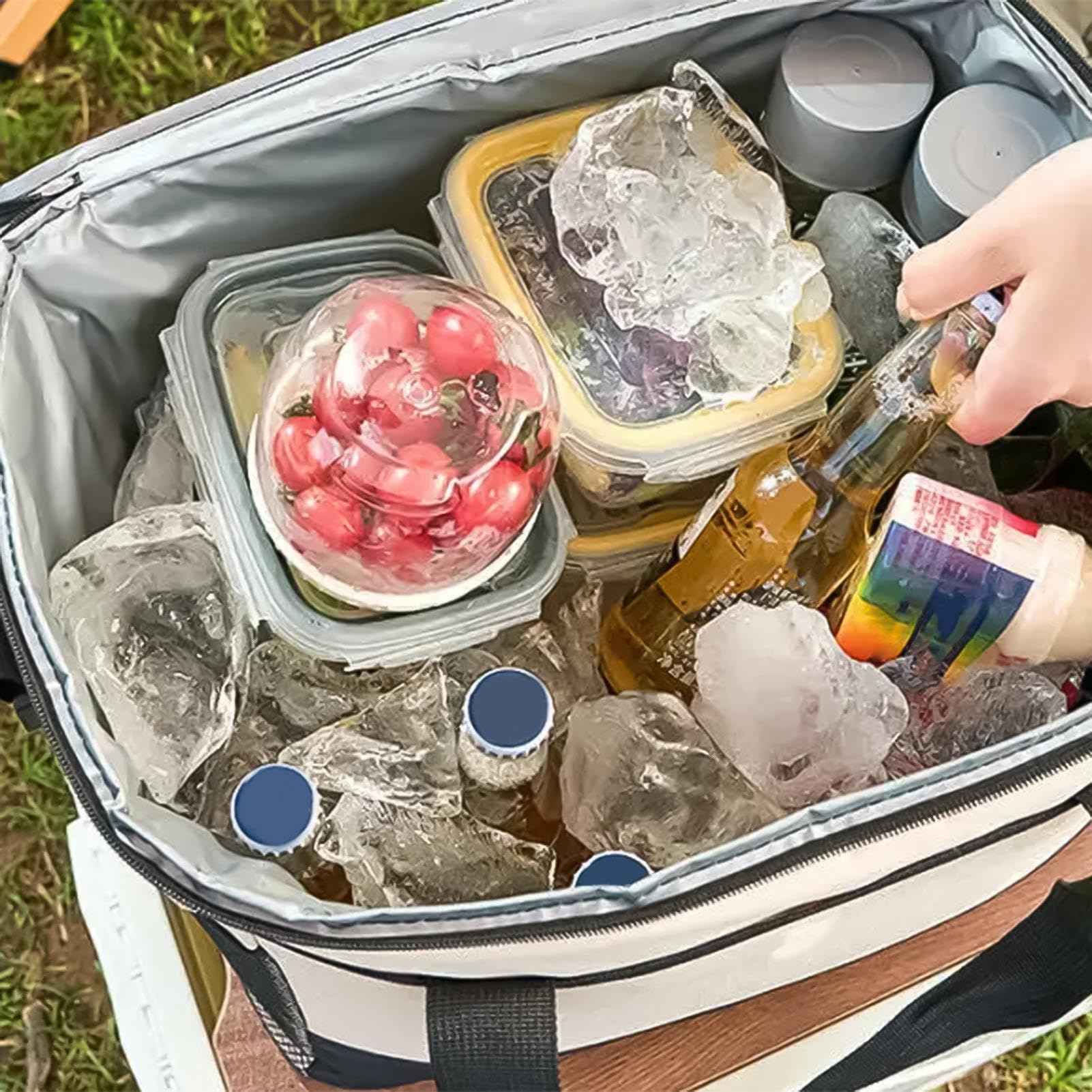 Insulated bag with food, ice, and drinks