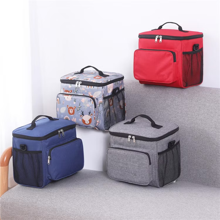 Four colorful insulated lunch bags with side mesh pockets and front zipper compartments