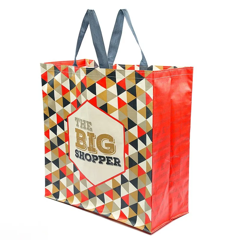 Large geometric patterned shopper bag with bold text
