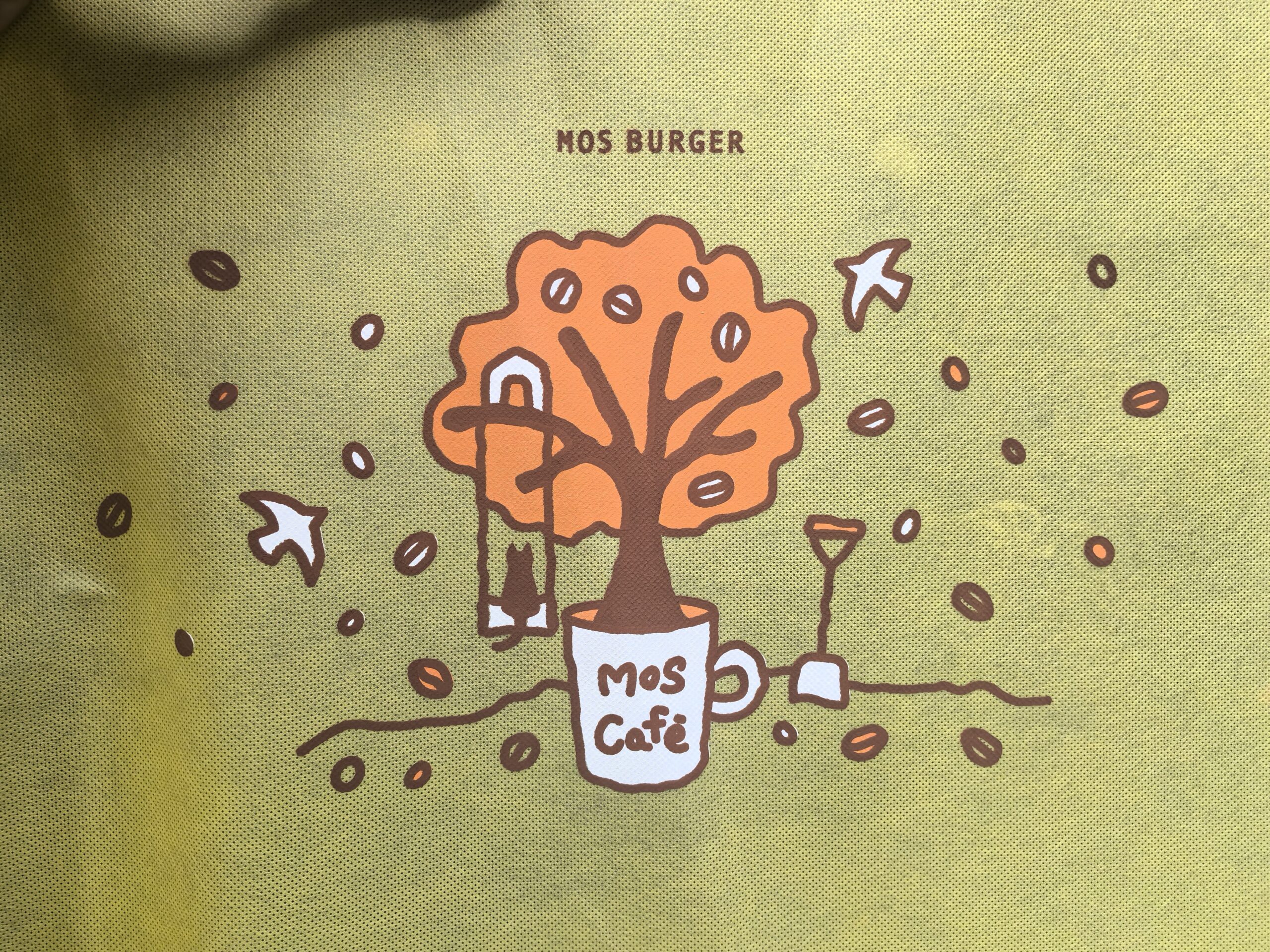 Custom printed non-woven bag for MOS Café with playful tree design