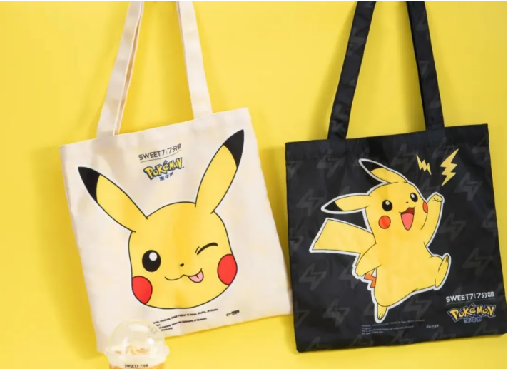 Two Pikachu-themed tote bags, one white and one black, on yellow background