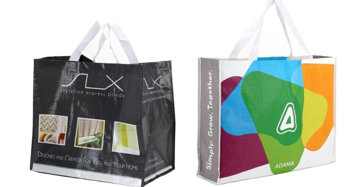 Reusable shopping bags with fruit prints and green handles
