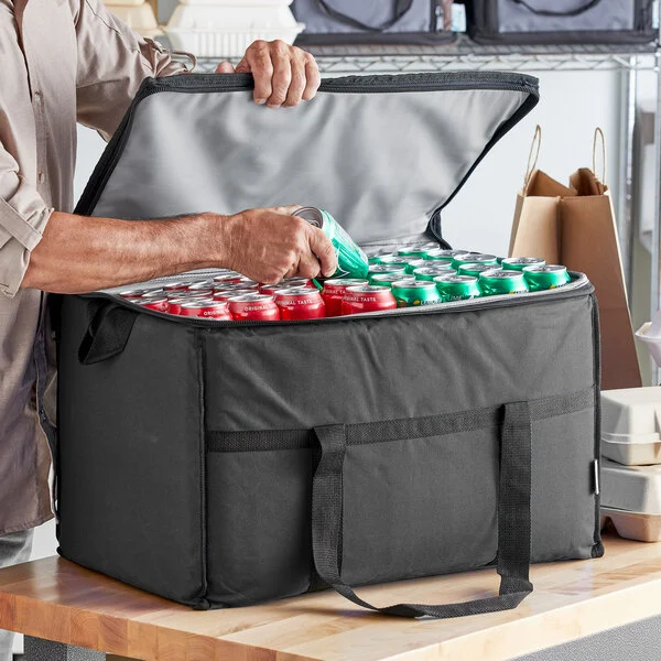 Large insulated bag filled with soda cans for transport