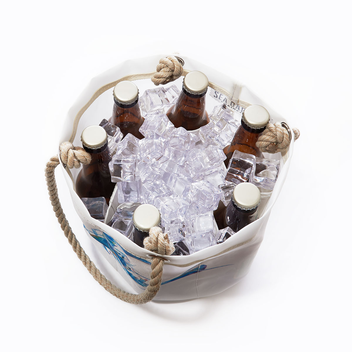 white insulated cooler bag with rope handles filled with ice and beer bottles