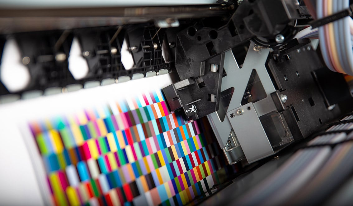 Close-up of digital printing machine printing colorful pattern