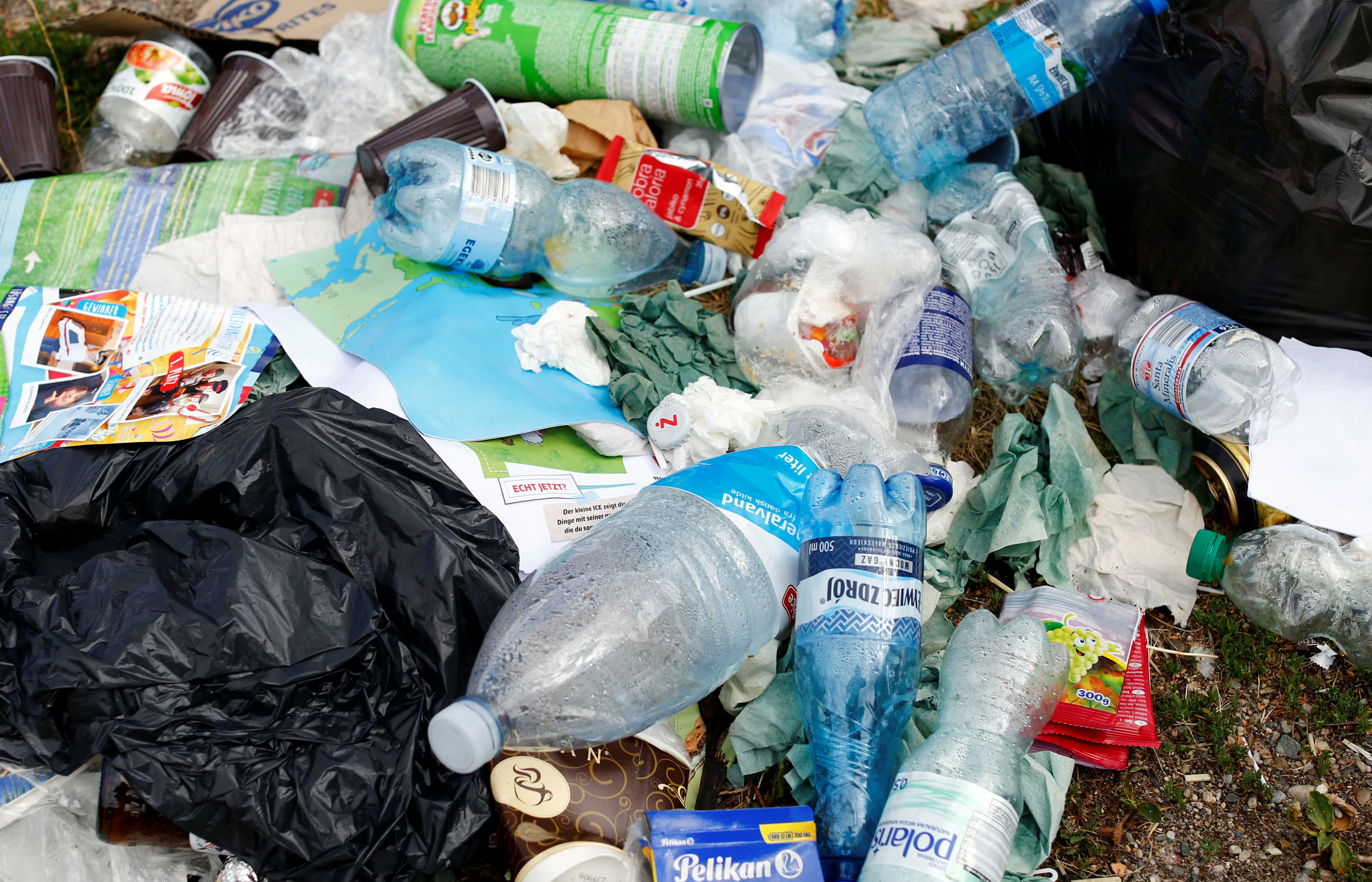 Various types of plastic and metal waste in a recycling pile