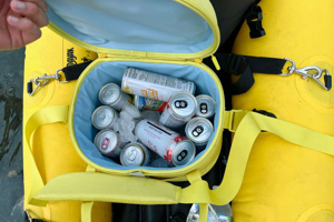 yellow insulation bag filled with beverage cans