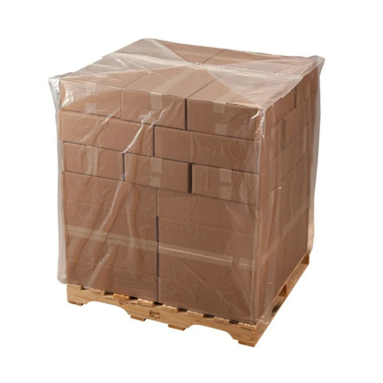 stack of brown cardboard boxes covered with plastic sheet on pallet