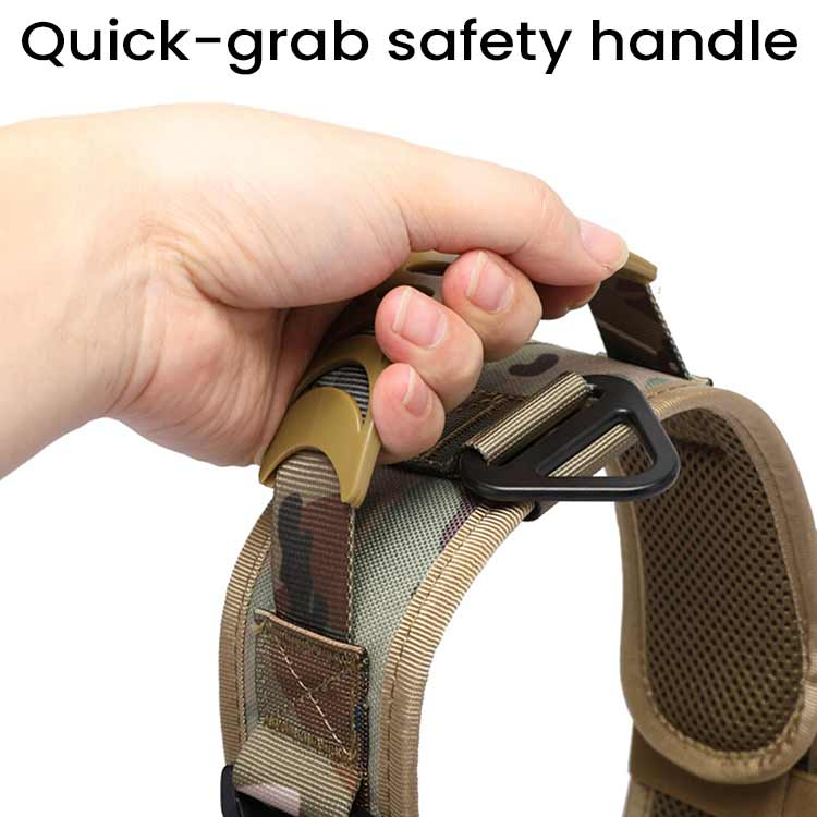 Hand holding quick-grab safety handle on tactical camouflage harness