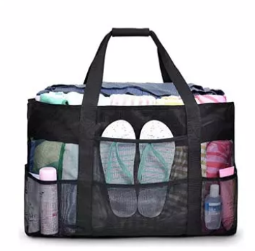 Black mesh travel tote bag with multiple pockets and organized items