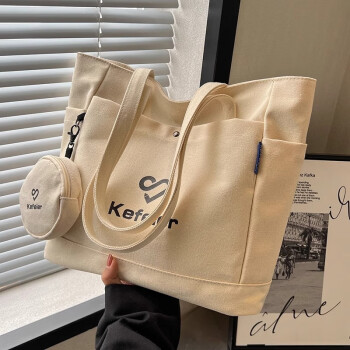 Beige canvas tote bag with side pockets and attached mini pouch