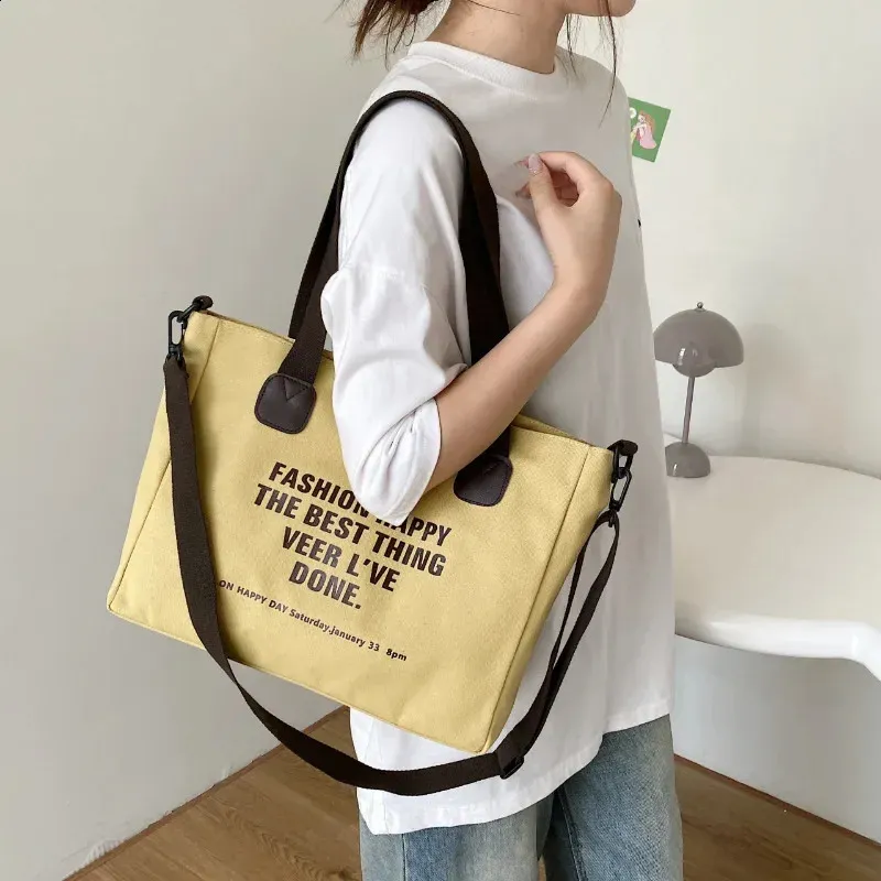 Casual yellow canvas crossbody bag with bold printed text design