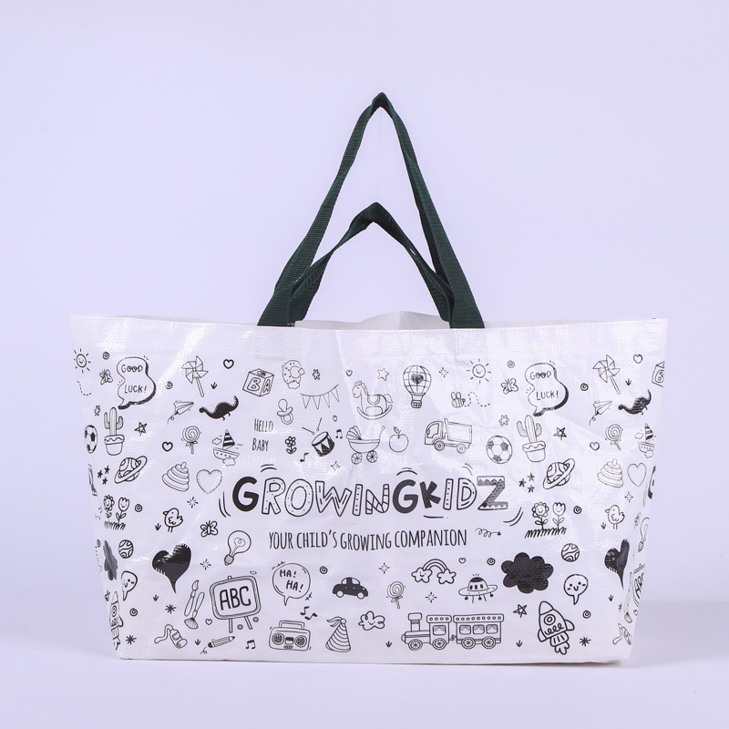 White reusable woven shopping bag with cartoon prints and black handles