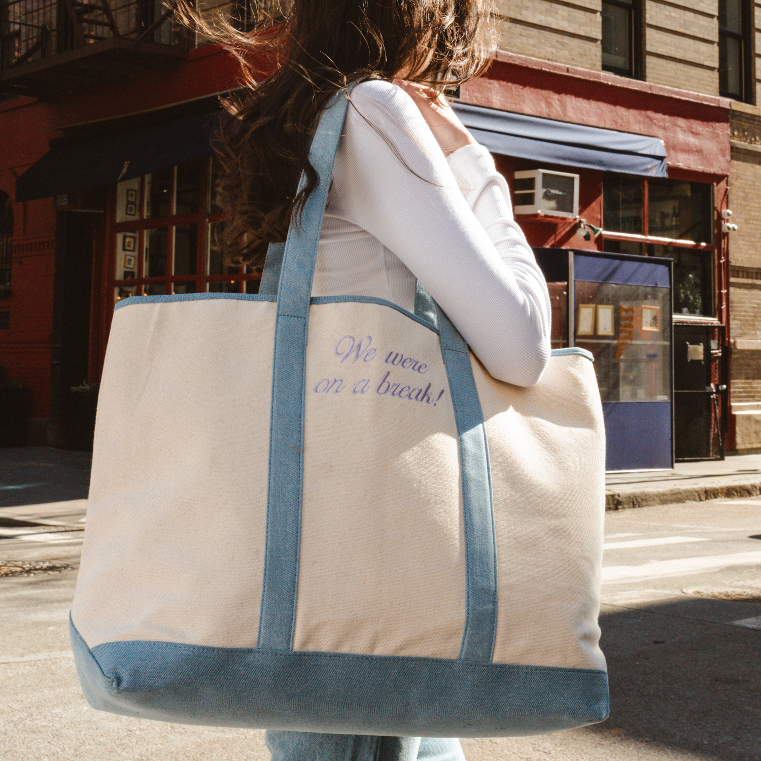 Large beige and blue canvas tote bag with We were on a break! text