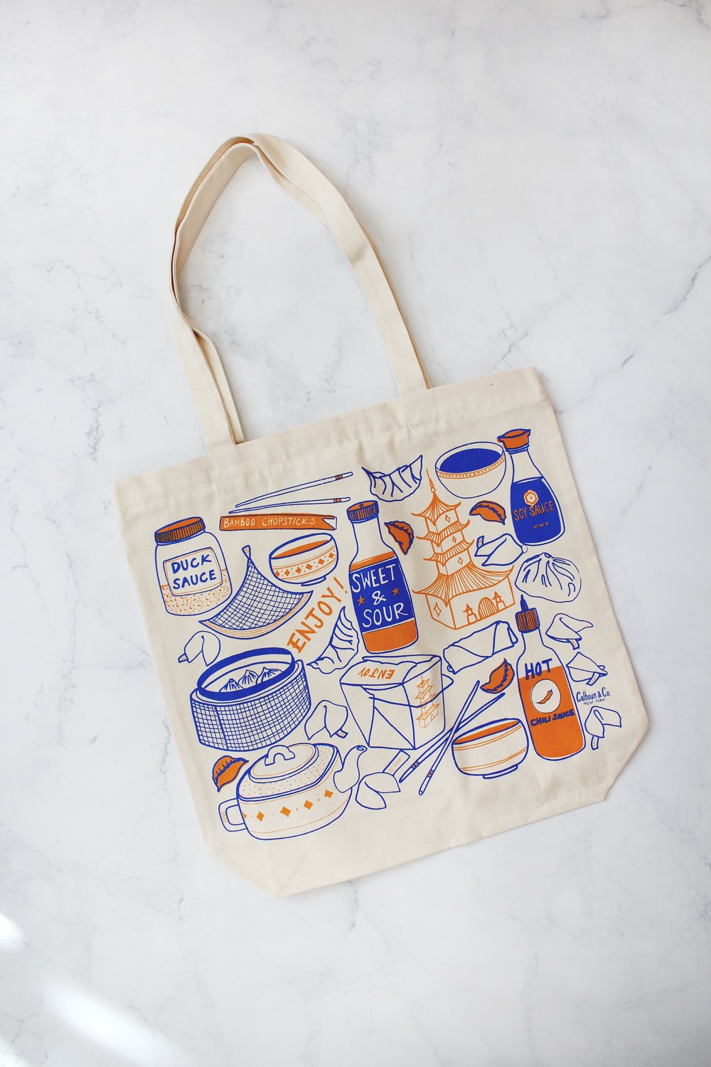 Beige tote bag with colorful Asian food and sauce illustrations