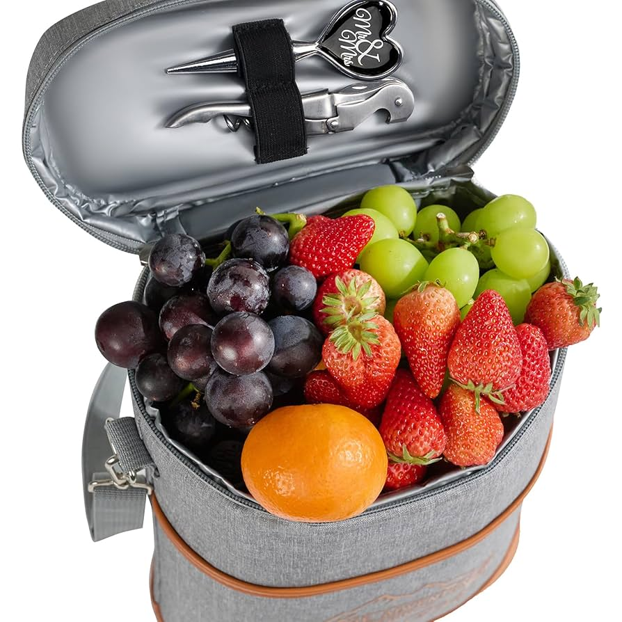 Gray insulated cooler bag filled with fresh fruits and picnic tools