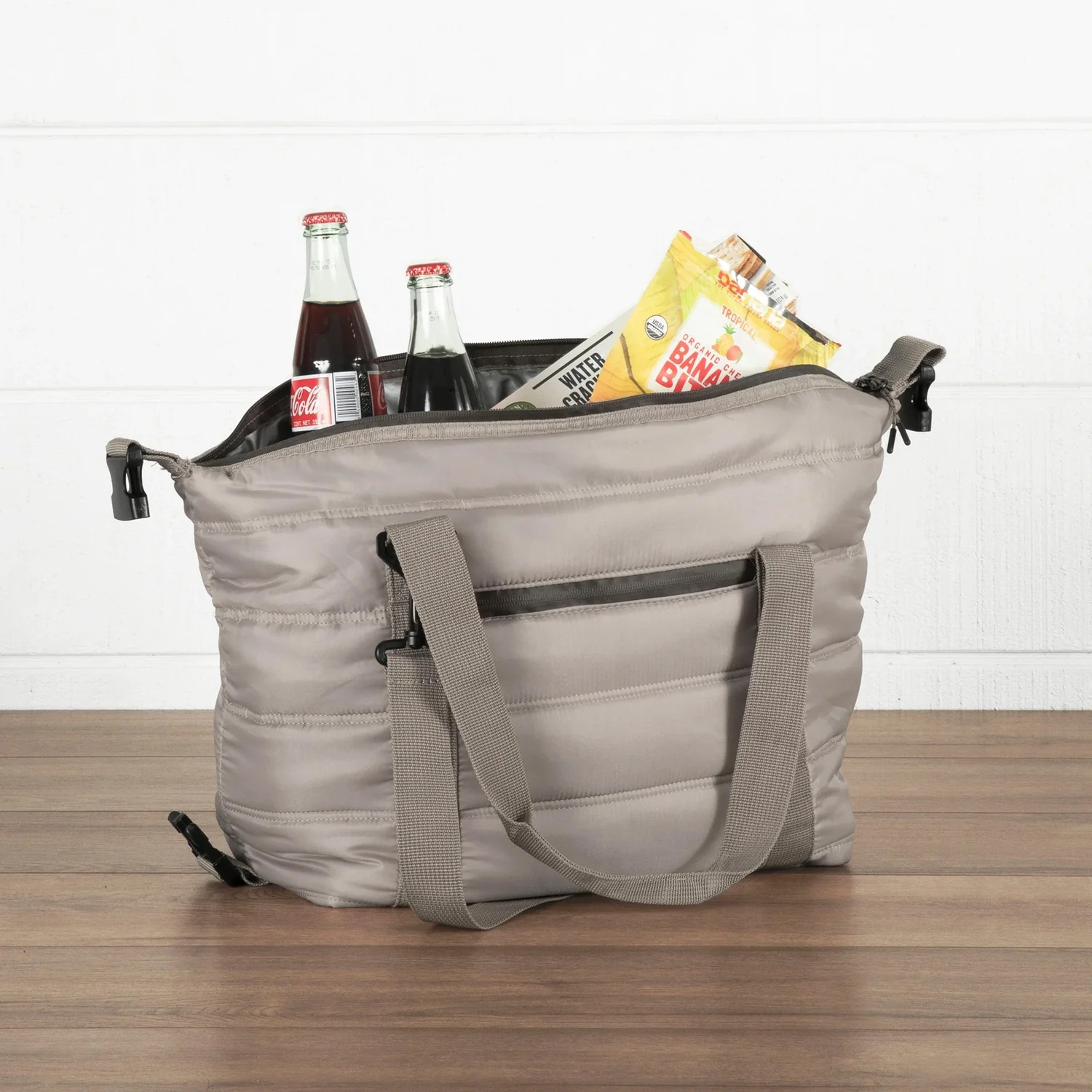 Gray insulated cooler bag filled with snacks and drinks