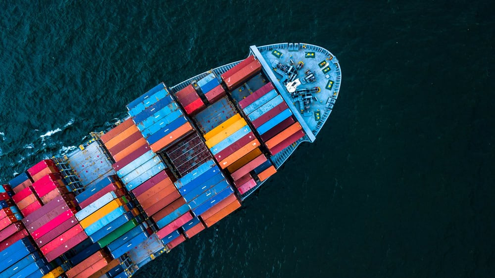 Aerial view of cargo ship carrying colorful containers