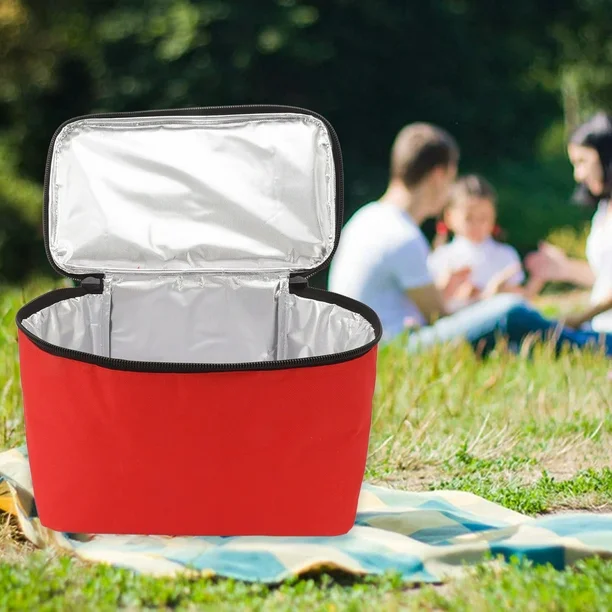 Red insulated cooler bag used outdoors at a picnic